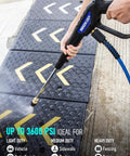Person using Beefy Universal Pressure Washer Gun With Stainless Extension Replacement Wand Fits Ryobi Greenworks Simpson DeWalt 3600 PSI M22 14 Fitting And 1 4 Inch Quick Connect For Car Wash on driveway tiles.