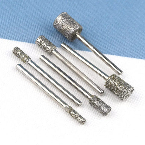 Pro Grade Diamond Grinding Burr Drill Bit Set One Eighth Inch Shank, 46 Grade Diamond Burrs with Cylindrical Heads on fabric surface