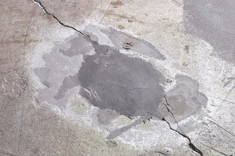 Concrete floor repaired with DP600 Gray Self-Leveling Concrete Repair Sealant Cartridge With 2 Mix Nozzles 8.4 Fl Oz Fast Tack In 1 Minute And Hardens In 5 Minutes For Cracks And Spalls On Horizontal Concrete.