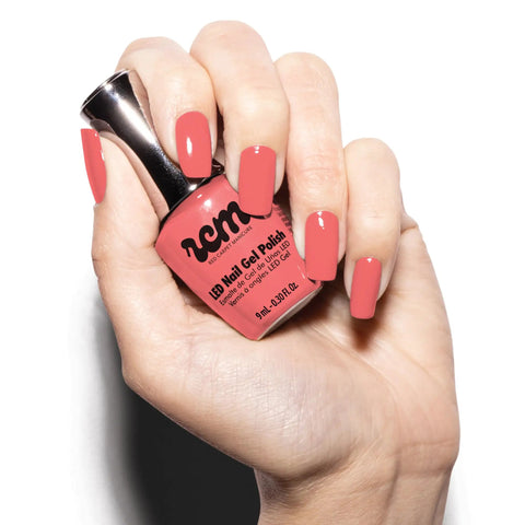 Hand holding a bottle of Hollywood Vibes Hema Free Gel Nail Polish Delivers Long Lasting Chip Resistant Manicure For Weeks Safe For Sensitive Skin 9ml Bottle Premium Salon Quality Gel Polish Without Hema Or Di Hema