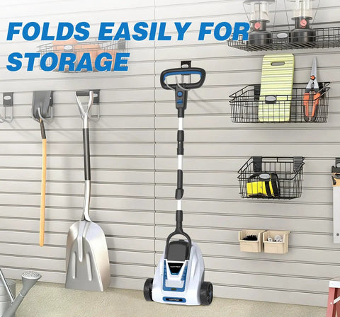 Cordless 9 Inch Mini Lawn Mower With 6000 RPM Brushless Power, folded for storage on a slat wall in a small yard area.
