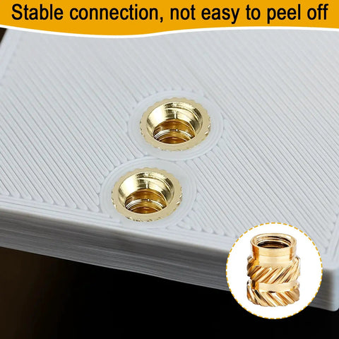Close-up of installed 1/4-20 Brass Heat-Set Threaded Inserts For 3D Printing, 32 Pack in white thermoplastic, stable connection shown.
