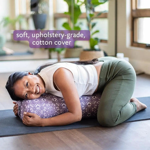Beefy Rectangular Yoga Bolster For Deep Restorative Poses Ultra Firm Foam Core With Cotton Cover Handmade In The USA Black 25 In By 11 In By 5 In 5 Lb Restorative Pillow You Can Count On. woman using purple rectangular yoga bolster on mat
