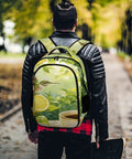 Person wearing Tropical Hummingbird Lemon Coffee Print Unisex Backpack With Large Capacity in a park setting, back view