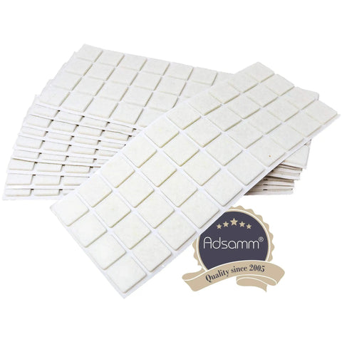 Four Hundred White Square Self Adhesive Felt Pads For Furniture And Chairs Big Time Floor Protectors stacked in rows.