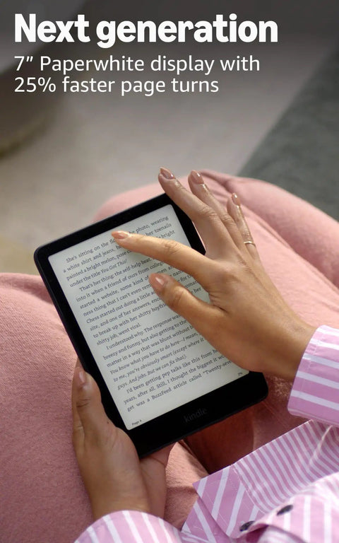 User holding Kindle Paperwhite Signature Edition 7 Inch E Reader with 32GB storage showing text on screen.