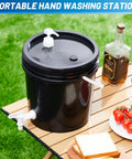 Kick Hassle Free Cleaning With This Slick Portable Hand Wash Station And Pump Soap Dispenser Featuring A Roomy Two Point Six Gallon Tank Perfect For Tailgates Campsites Job Sites Or Road Trips To Keep Your Crew Fresh On The Fly. Black portable hand wash station and pump on a picnic table outdoors.