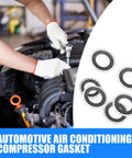 Thirty Piece Auto Air Conditioning Compressor Port Gasket Kit with rubber sealing rings in use during vehicle maintenance.