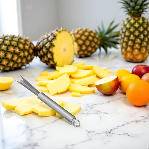V Shaped Stainless Steel Pineapple Eye Cutter And Remover Tool for Home Kitchen on marble counter with sliced fruit