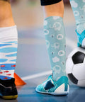 DIY Sublimation Blank Socks Kit With 2 Metal Straight Sock Jigs And 2 Pairs Of Blank Socks For At Home Heat Press Dye Sublimation Printing And Creative Pattern Designs shown with children wearing printed socks.