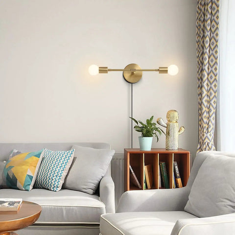 Gold Plug In Wall Sconce Two Light Bathroom Vanity Light Brass Wall Reading Light Retro Vibe Mid Century Modern Style For Hallway Living Room And Dining Room Lighting in a modern living room.