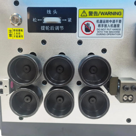 Close-up of the control panel and rollers of the Jaryannix Automatic Wire Stripping And Bending Machine 110V for Electrical Projects.