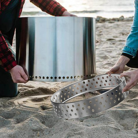 Assembly of Sturdy 19.5 Inch Fire Pit Stand For Bonfire And Other 19.5 Inch Pits Stainless Steel on a sandy surface