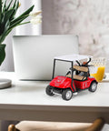 Red And White Die Cast Metal Miniature Golf Cart Replica featuring steering wheel, tan seats, and storage basket on table.