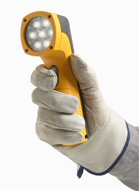 Rock Solid LED Stroboscope Featuring 30 To 300000 FPM Flash Rate And Knockout Brightness held in a gloved hand for inspection.