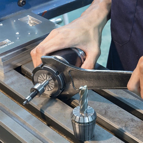 Heavy Duty ER40 Collet Chuck Holder For CNC Lathe Made With High Carbon Steel And Hardened To Rockwell 50 in use with a wrench.