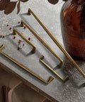 Brushed Brass Cabinet Handles, 12.6 Inches, 320mm Hole Center, Zinc Alloy Pulls For Kitchen And Bedroom displayed on tabletop
