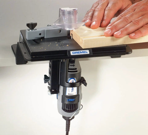 Portable Rotary Tool Shaper And Router Table Attachment for woodworking, bench-mounted with wood being sanded