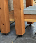 Heavy Duty Adjustable Leveling Feet Kit With M10 Thread And T Nut For Workbenches Cabinets Sofas And Uneven Floors Includes 12 Pack No Sweat Installation showing installed underneath wooden bench leg