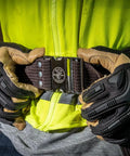 Person fastening the 2 Inch Wide Electrician Tool Belt, Adjustable Up To 48 Inch Waist, Beefy Nylon Webbing With Quick Release Metal Buckle.