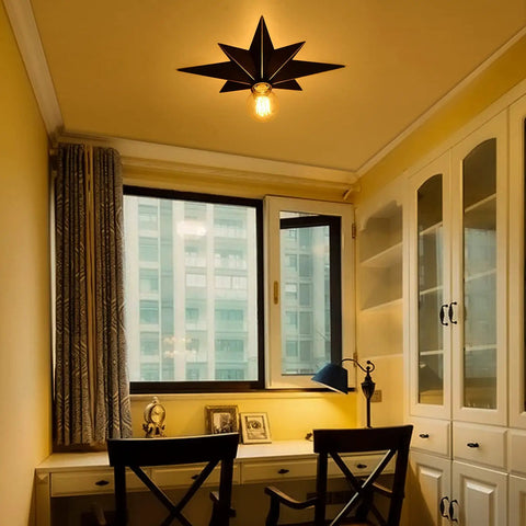 16 Inch Industrial Black Metal Star Flush Mount Ceiling Light With Vintage Farmhouse Vibe installed in a study room.