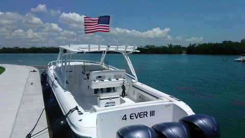 Saltwater Ready American Flag With Pole For Boat Rod Holder Tough PVC Flag Flyer on docked white boat