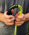 Person holding Pressure Washer Hose With M22 Fittings, 1/4 In By 25 Ft, ZillaGreen Flexible Hybrid Polymer with no kink bend restrictor