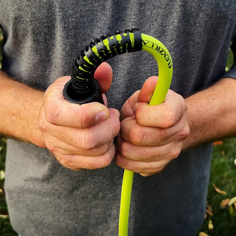 Person holding Pressure Washer Hose With M22 Fittings, 1/4 In By 25 Ft, ZillaGreen Flexible Hybrid Polymer with no kink bend restrictor