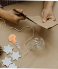 Crafting scene featuring Pro Grade Three Piece Pin Vise Drill Set for jewelry making and watch repair with wooden handle