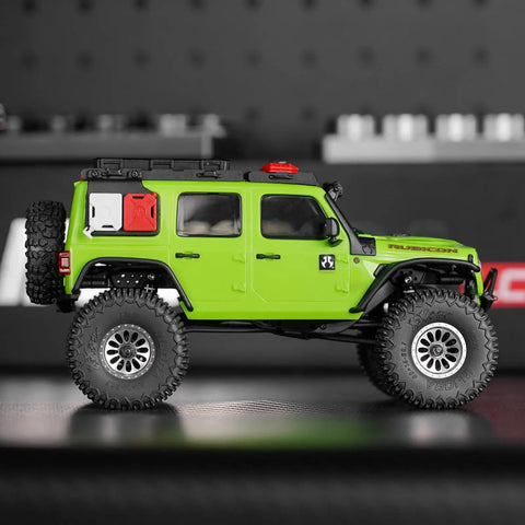 Green RC car with XHX 0.7 Inch Pin Tires 40x14mm For 1 To 30 Scale Axial SCX30 RC Car With Soft Sticky S5 Compound
