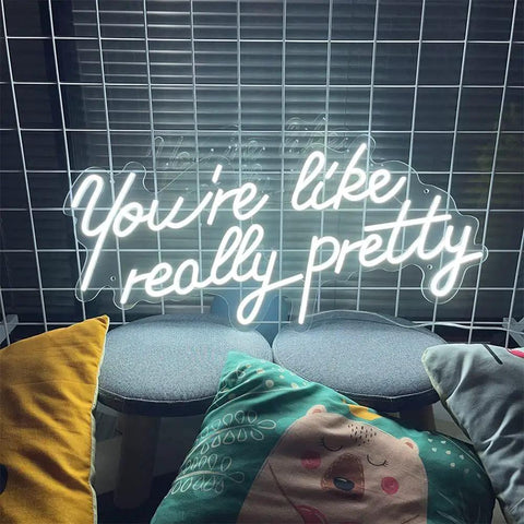 You Are So Pretty Neon Sign Led Light Up Wall Decor Made From Transparent Acrylic For Indoor Use In Living Room Bedroom Office Party Wedding Christmas Gift 29.9 By 13.7 Inches Cool White glowing on a grid wall with cushions below