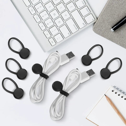 Slick Magnetic Silicone Cable Ties 10 Pack for Laptops with black clips and USB cables on desk.