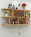 Solid Wood Wall Mounted Wine Rack With Stem Glass Holder Kickback Ready Industrial Vintage Vibe Multipurpose Storage Shelf displaying various bottles.
