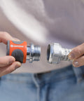 Premium Metal Quick Connect Hose Fittings Set For Five Eighths Or Half Inch Hoses being connected by hands