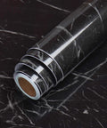 Black Marble Peel And Stick Countertop Paper 36x160 Inches Self Adhesive Vinyl Film close-up on roll with marble pattern