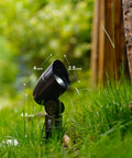 Low Voltage Landscape Lighting Floodlight And Spotlight Kit 3W LED 3600K Warm White 8 Pack outdoor light in grass next to tree