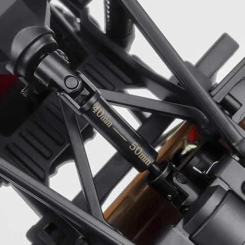 Beefy 1144 CNC Steel RC Driveshafts 40x40mm Front And Rear Center Transmission Shafts close-up on vehicle