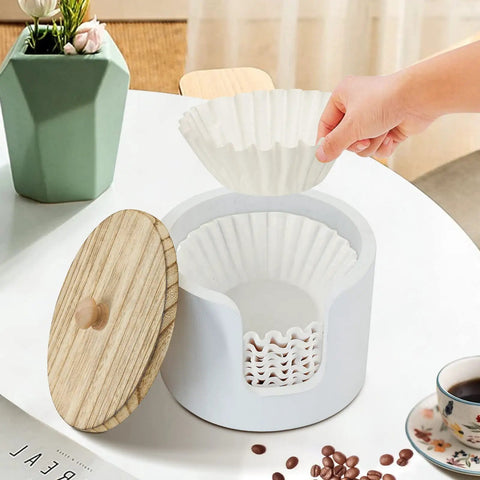 Person placing filter into Go-To Coffee Filter Holder With Lid For Countertop Storage, The Ultimate 8-12 Cup Coffee Station Organizer