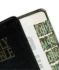Slick Forest Camo Bible Tabs For Study Bibles And Journals With Dope Self Adhesive Backing on a black Holy Bible's edge.