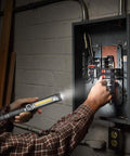 Ultra Bright Work Light With Magnetic Base And COB Flood Beam 500 Lumens used to illuminate open electrical panel