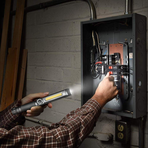 Ultra Bright Work Light With Magnetic Base And COB Flood Beam 500 Lumens used to illuminate open electrical panel