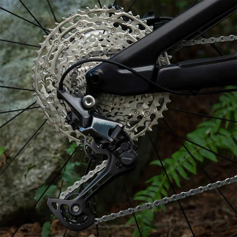 Deore CS M6100 12 Speed Cassette 10 To 51T for Mountain Bikes installed on bicycle with aluminum carrier and steel cogs.