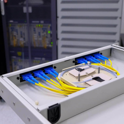 Fiber Optic Coupler FC APC Round Single Mode Simplex Cable Adapter installed in data center setup with blue and yellow cables