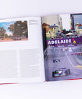 Rivals Of The Track F1s Greatest Duels Volume 4 open page showing Adelaide race scene with cars on track and city backdrop.