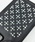 Close-up of the spray face with easy-clean silicone nozzles of the matte black handheld shower system.