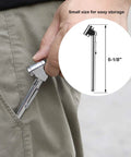 Pencil-style tire pressure gauge with dual head chuck, chrome steel body, 6-1/8 in long, held near pocket.