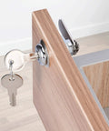 Cabinet Cam Lock Set 5 Pack Keyed Alike 1-1/8 Inch Cam Locks For File Drawers Dressers Mailboxes And RVs Replacement Lock Hardware Chrome Finish Zinc Alloy installed on a wooden cabinet door