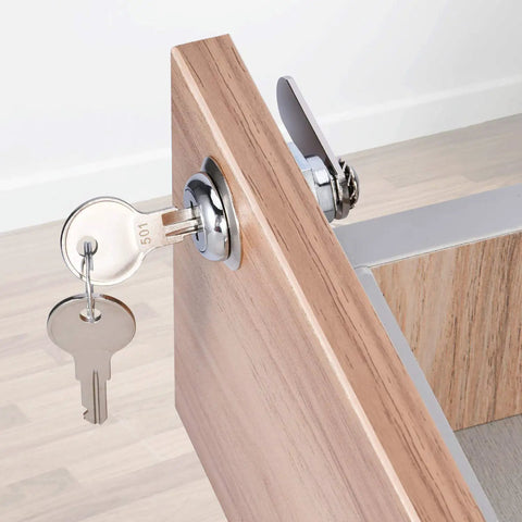 Cabinet Cam Lock Set 5 Pack Keyed Alike 1-1/8 Inch Cam Locks For File Drawers Dressers Mailboxes And RVs Replacement Lock Hardware Chrome Finish Zinc Alloy installed on a wooden cabinet door