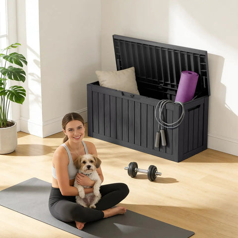 90 Gallon Waterproof Deck Box With Lockable Lid for patio storage, contains cushions, and yoga mat. Made of weatherproof resin, black color.