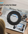 10X Magnifying Glass With Light And Stand over newspaper text, demonstrating clarity enhancement with 144 LED desk lamp.